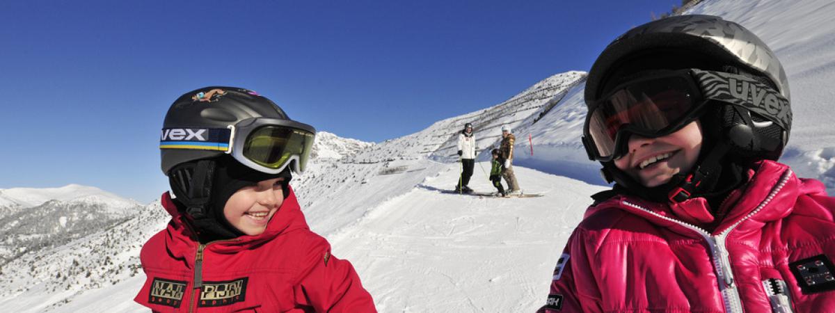 Two children skiing